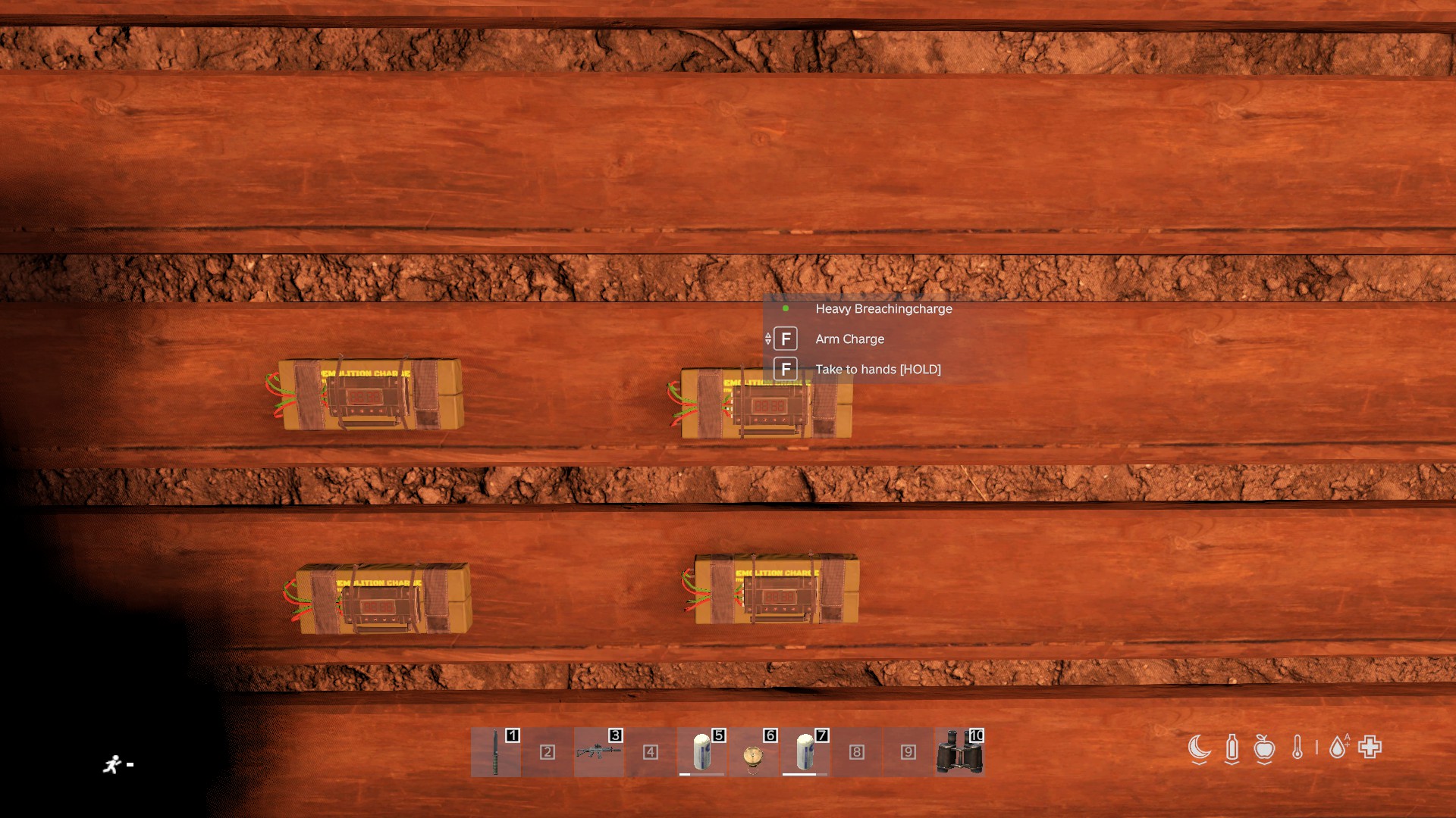 Four heavy breaching charges placed on a wall, ready to arm.