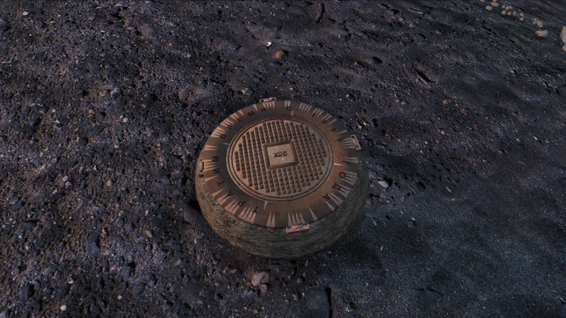 The finished entrance — an XDC manhole cover sitting on a patch of dirt.